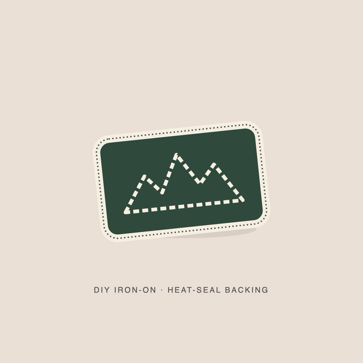 Illustration: Ridgeline mountain line as a green iron-on with a cream merrowed edge. Not a photograph.