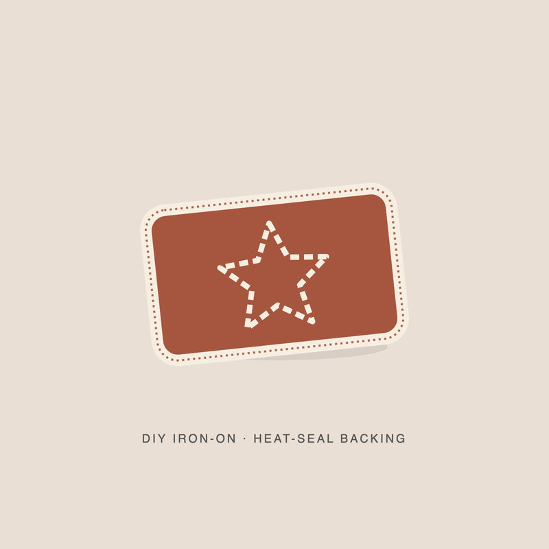 Illustration: Sunset star as a brick iron-on with a cream merrowed edge. Not a photograph.